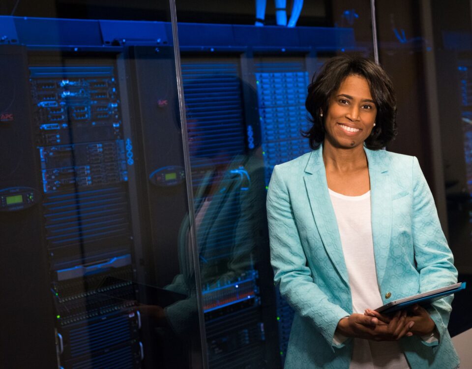 Network engineer reviewing firewall rule policy on server rack monitor