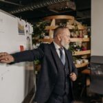 Security analyst mapping threat intelligence connections on office whiteboard