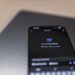 Smartphone displaying AI workflow dashboard in secure enterprise office environment