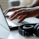 Person examining suspicious login alert on laptop security screen
