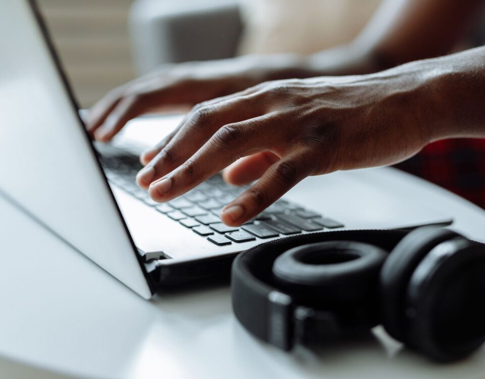 Person examining suspicious login alert on laptop security screen