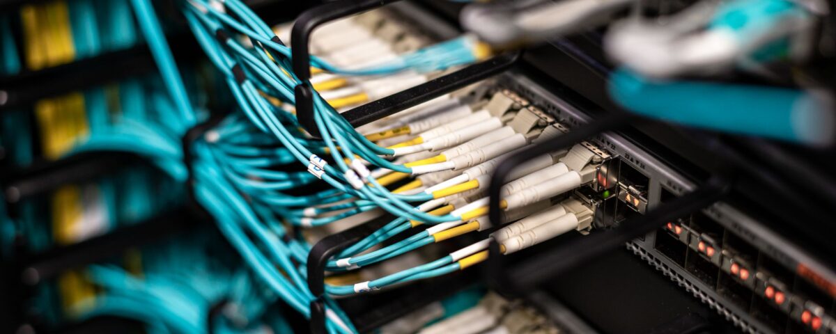 Enterprise server room with red warning lights during a security incident