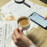 Financial breach cost reports spread across a corporate office desk