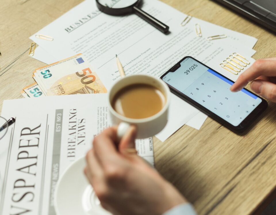 Financial breach cost reports spread across a corporate office desk