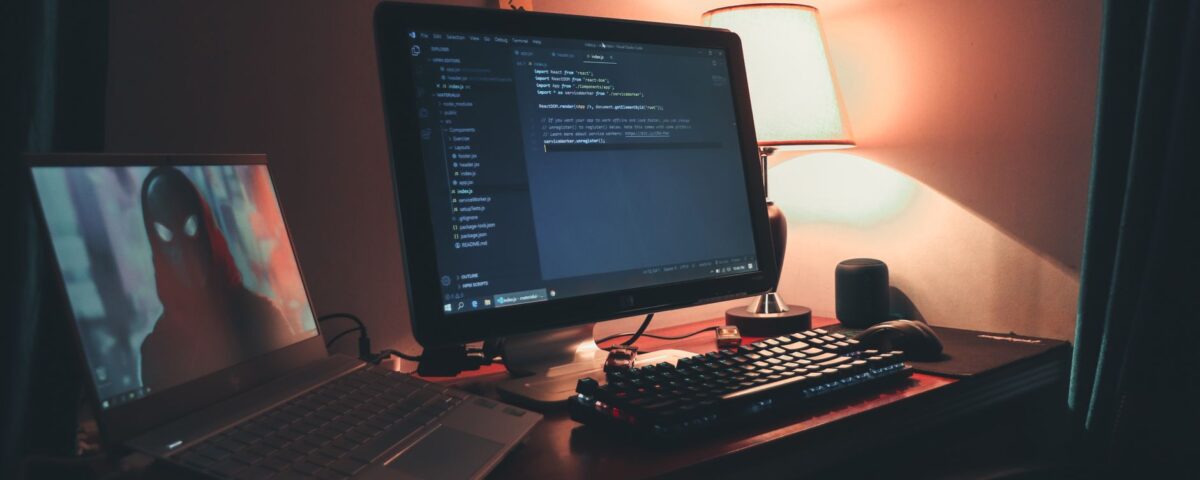 Developer reviewing secure code with security annotations on dual monitors