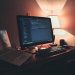 Developer reviewing secure code with security annotations on dual monitors