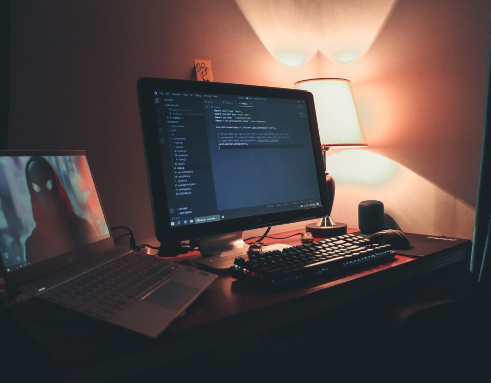 Developer reviewing secure code with security annotations on dual monitors