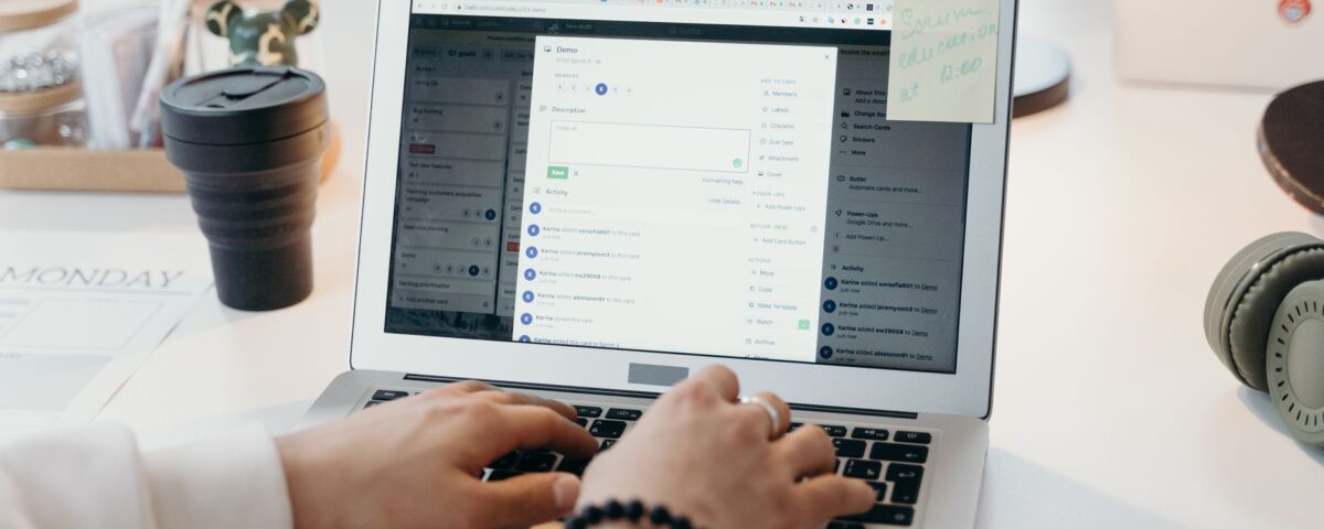 Office worker carefully examining a suspicious phishing email on laptop