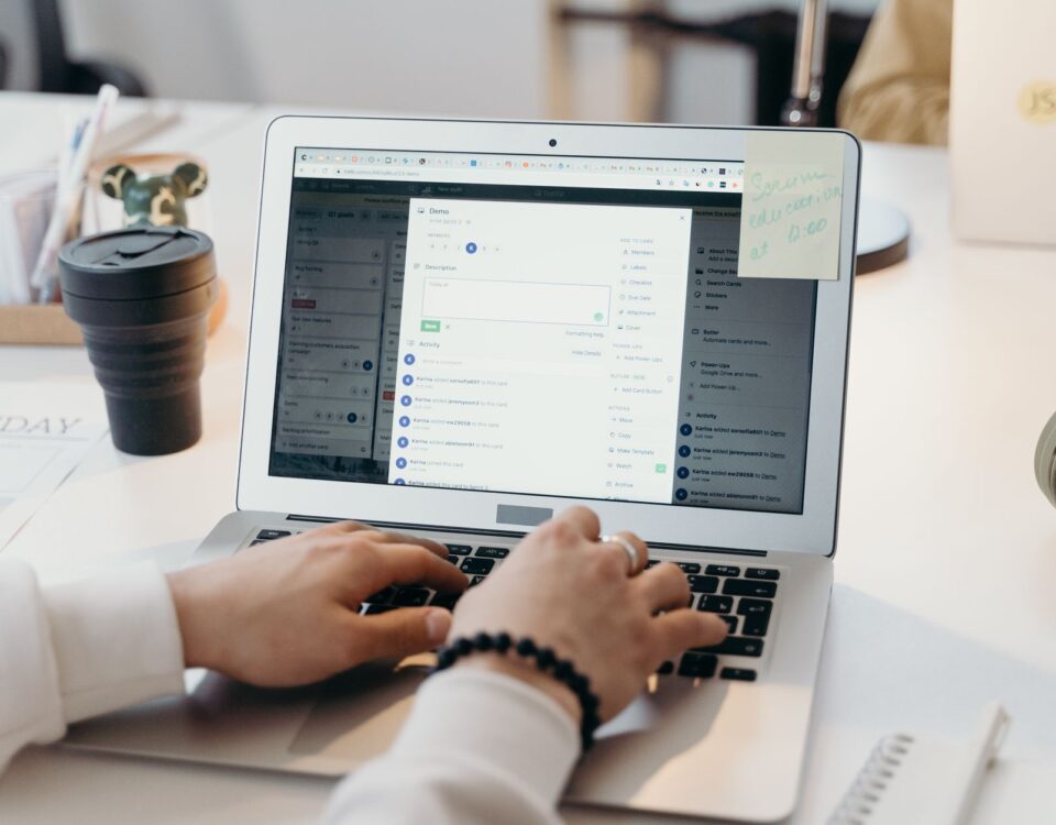 Office worker carefully examining a suspicious phishing email on laptop