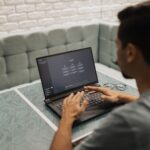 Security analyst reviewing endpoint threat alerts on dual monitors in SOC