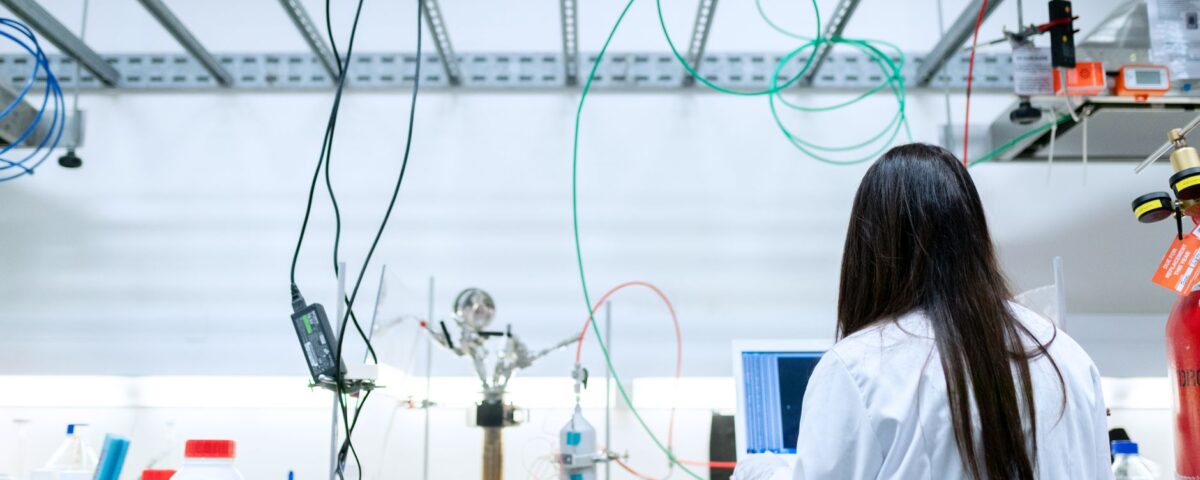 Security researcher analyzing adversarial machine learning model output charts in laboratory