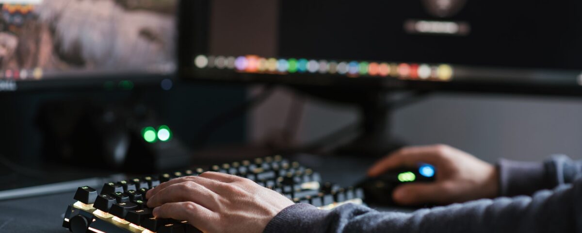 Robotic arm pressing keyboard keys in a server room environment