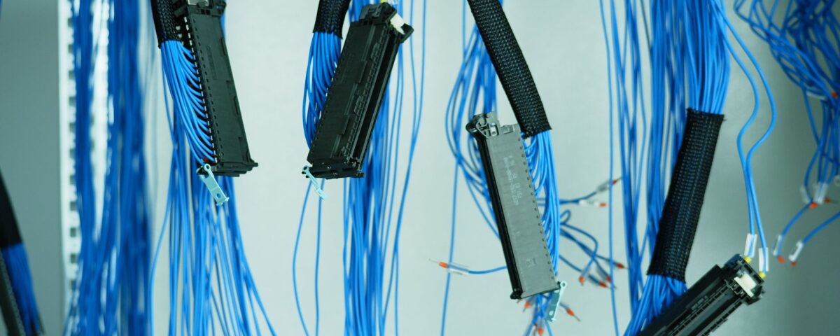 Dense server rack cables and blinking LEDs in enterprise data center