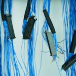 Dense server rack cables and blinking LEDs in enterprise data center