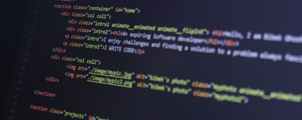 Dark terminal screen displaying scrolling code in a dim server room