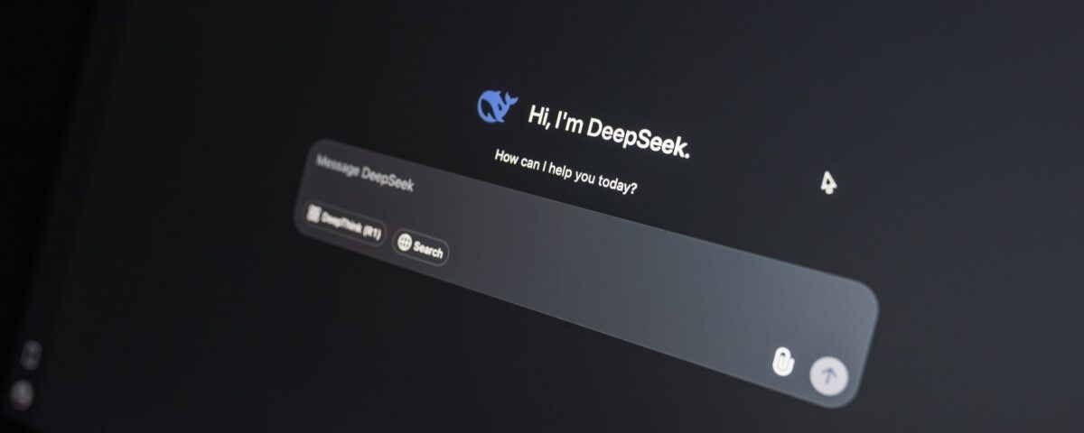 Corporate laptop displaying AI chatbot interface with sensitive conversation data visible