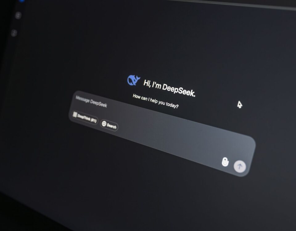Corporate laptop displaying AI chatbot interface with sensitive conversation data visible