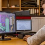 Security analyst reviewing AI threat intelligence dashboards in operations center