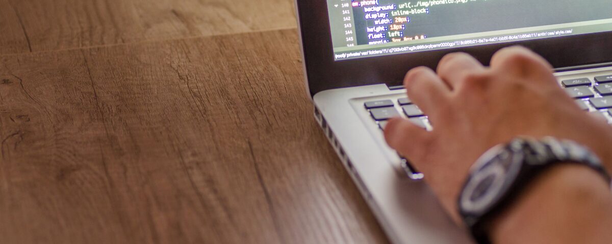 Laptop screen showing API plugin connections and authentication code strings