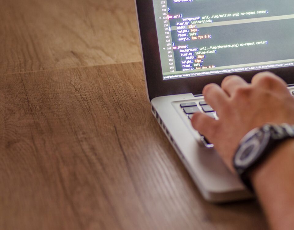 Laptop screen showing API plugin connections and authentication code strings