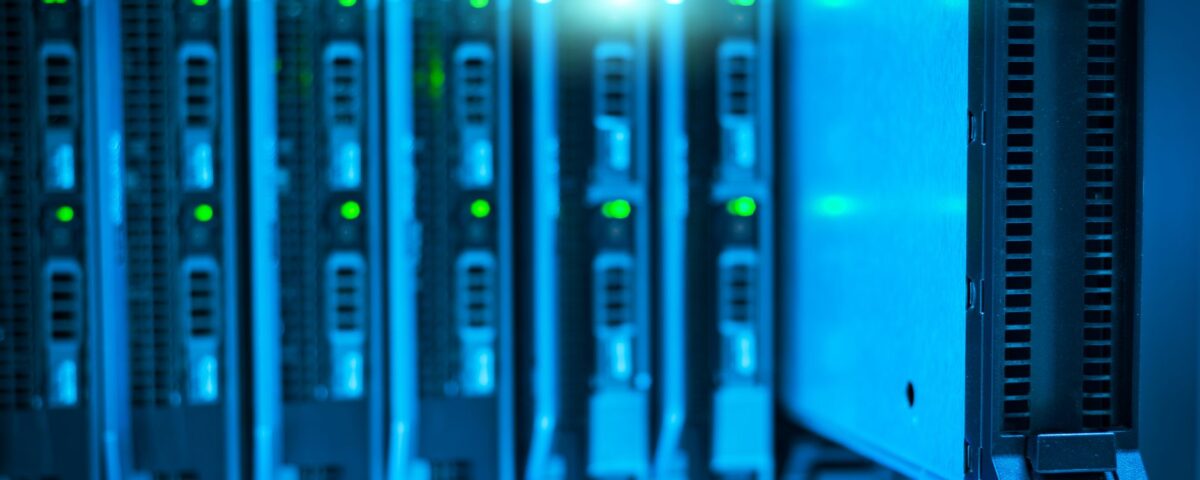 Security analyst reviewing API logs on monitor in enterprise server room