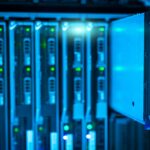 Security analyst reviewing API logs on monitor in enterprise server room