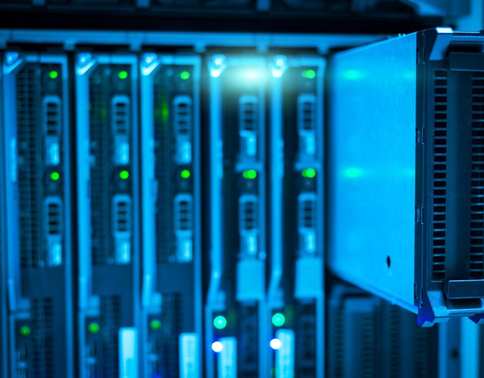 Security analyst reviewing API logs on monitor in enterprise server room