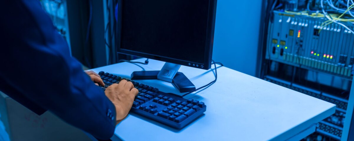Technician inspecting GPU server rack in enterprise data center facility