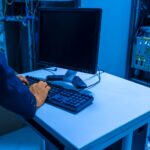 Technician inspecting GPU server rack in enterprise data center facility