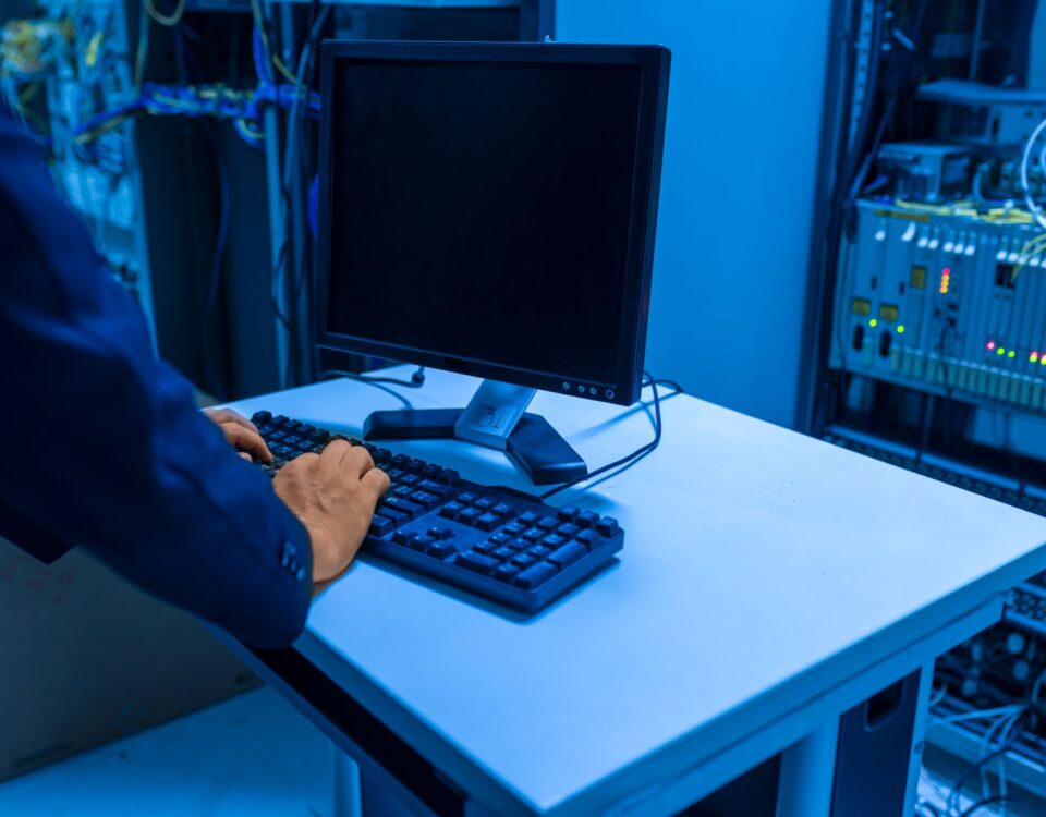 Technician inspecting GPU server rack in enterprise data center facility
