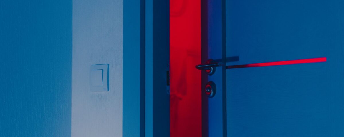 Open server rack with documents spilling out in dark data center