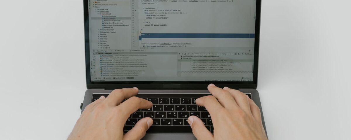 Security engineer reviewing AI prompt input and output logs on monitors