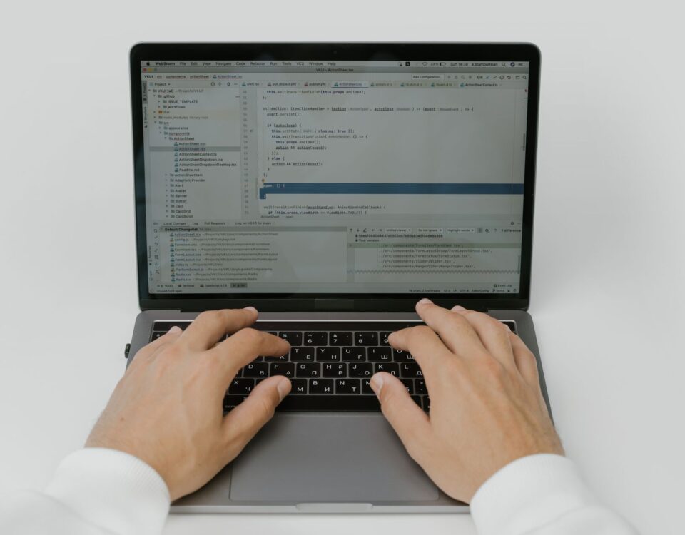 Security engineer reviewing AI prompt input and output logs on monitors