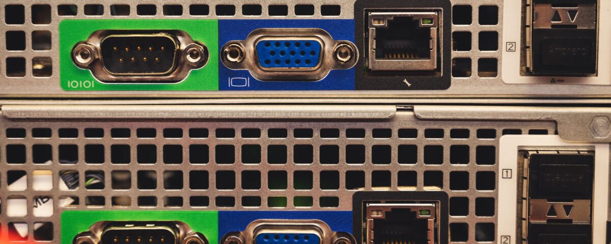 Multiple server racks connected by fiber optic cables in enterprise data center