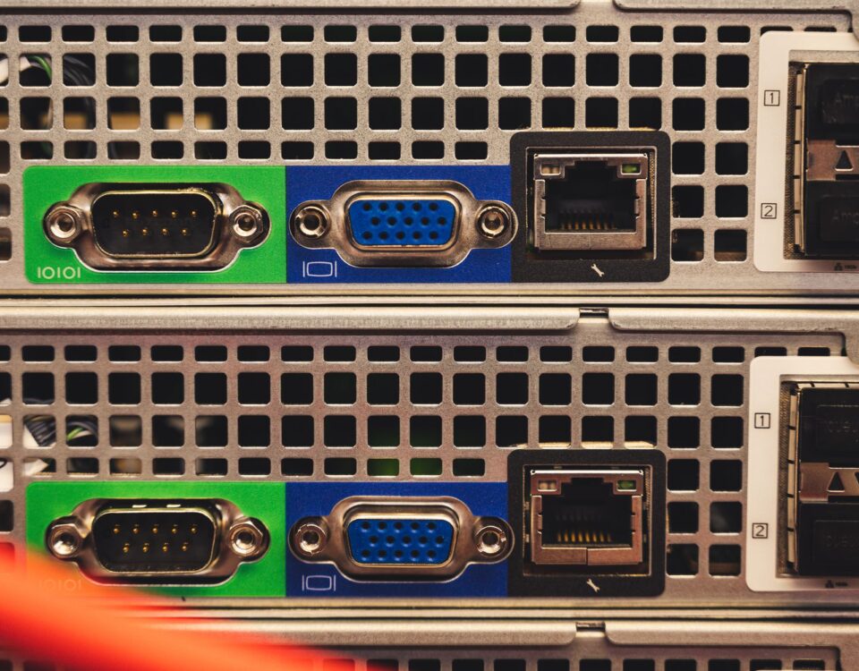 Multiple server racks connected by fiber optic cables in enterprise data center