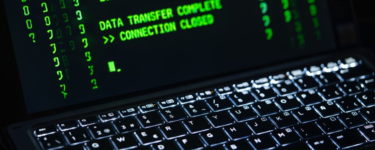 Laptop terminal displaying Gemini API authentication code with security key dongle