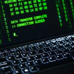 Laptop terminal displaying Gemini API authentication code with security key dongle