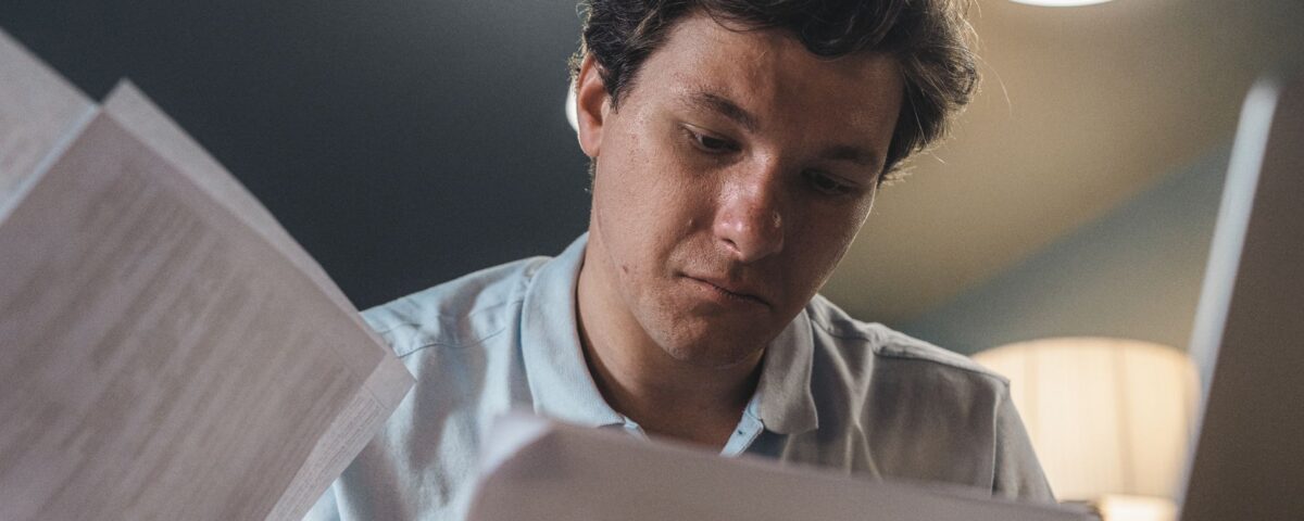 Security analyst carefully reviewing AI-generated threat intelligence output on monitor