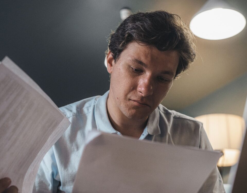 Security analyst carefully reviewing AI-generated threat intelligence output on monitor