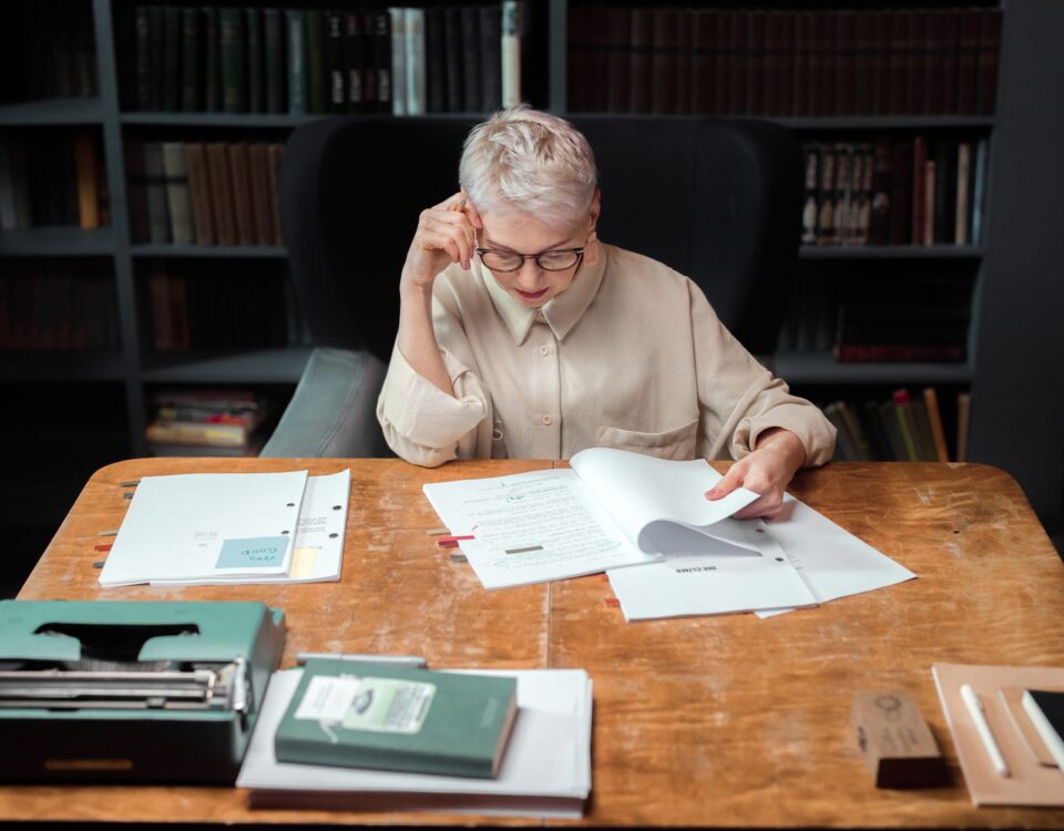 Robotic arm reading a document with hidden adversarial instructions on desk
