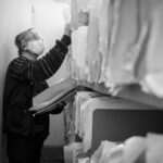 Person inserting false document into enterprise knowledge archive filing system