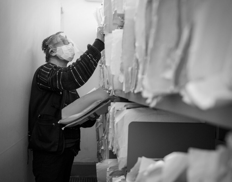 Person inserting false document into enterprise knowledge archive filing system
