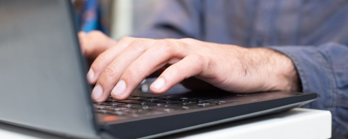 Security researcher typing prompt injection commands into a laptop terminal