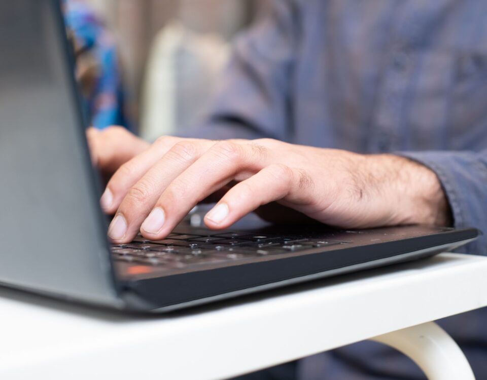 Security researcher typing prompt injection commands into a laptop terminal