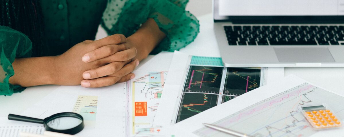 Security analyst reviewing AI risk management framework dashboards on monitors