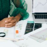 Security analyst reviewing AI risk management framework dashboards on monitors