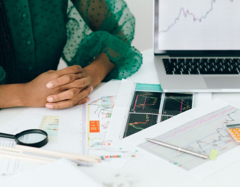 Security analyst reviewing AI risk management framework dashboards on monitors