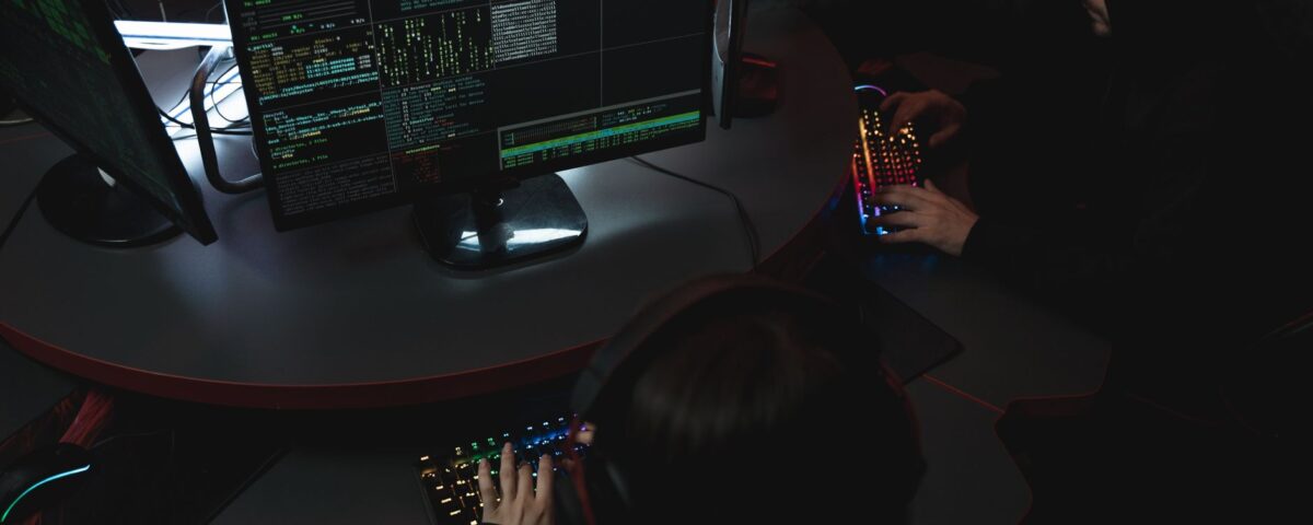 Security analyst reviewing LLM application code on dual monitors