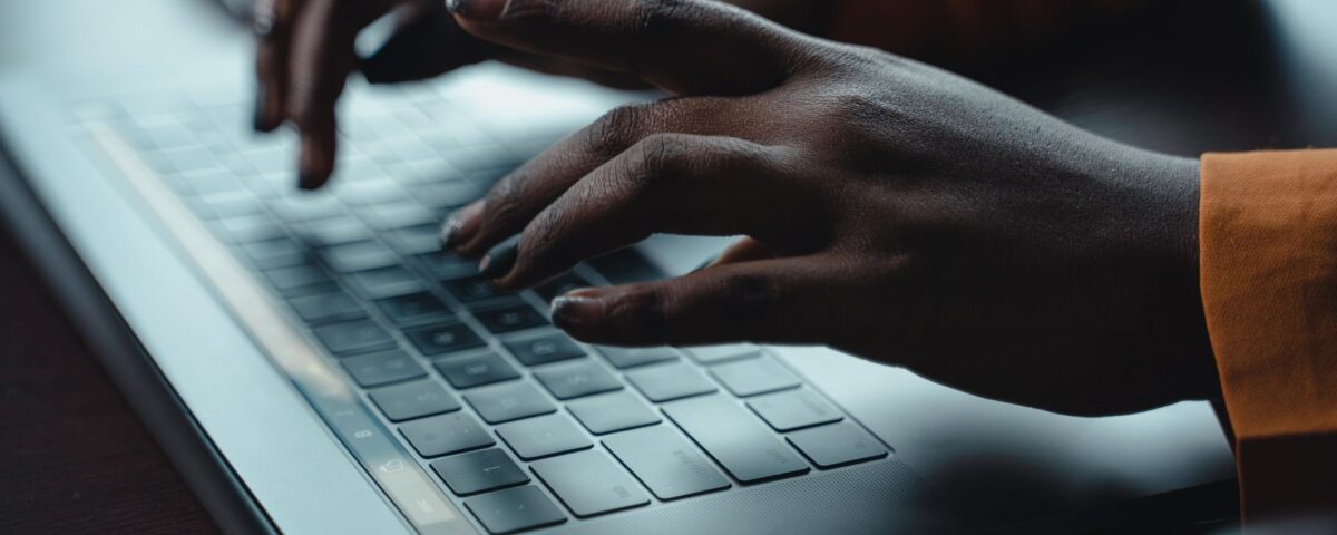 Person typing a document containing hidden white text prompt injection payload