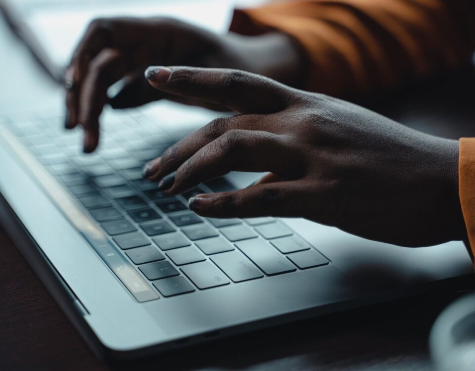 Person typing a document containing hidden white text prompt injection payload